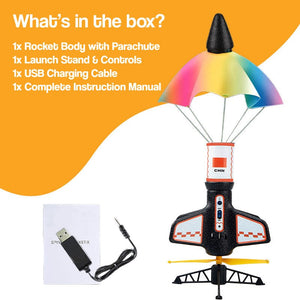 Sky & Beyond Rocket Launcher launching authentic model rocket with auto-deploying parachute in backyard STEM play