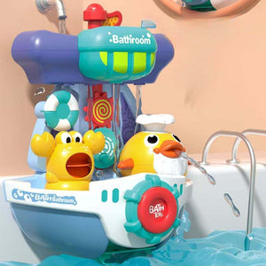 Spinning water-spraying bath toy in ivory white and fog blue for kids' sensory and skill development