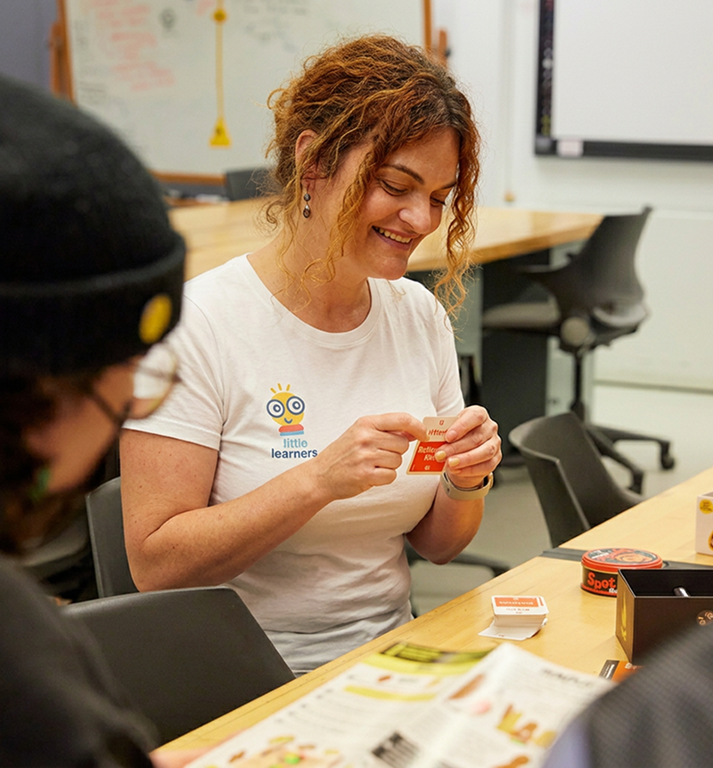 Sarah testing a card game with the team