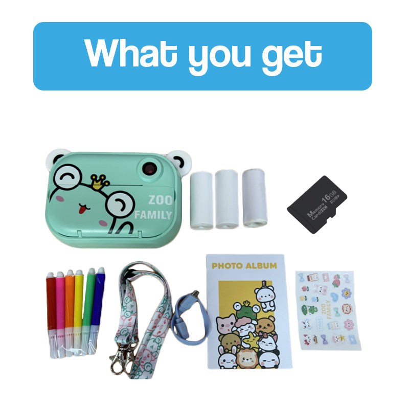 Kid instant print camera with frog design, six colored markers, lanyard, photo album, stickers, three thermal paper rolls, and 16GB memory card kit