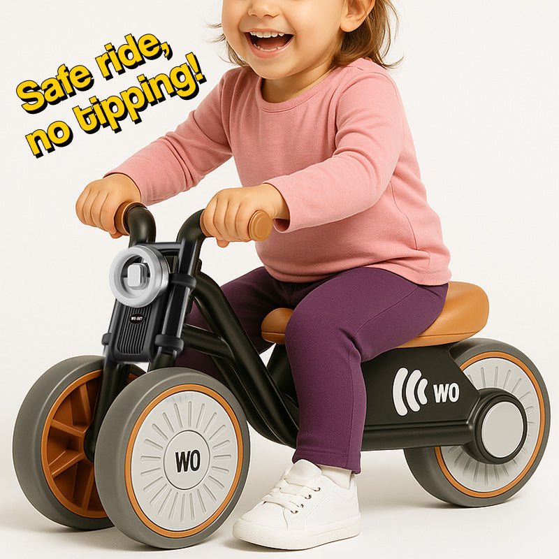 Toddler riding Tiny Biker Anti-Tip Light & Sound Motorcycle with safe anti-tip design and silent EVA wheels