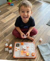 Carol’s granddaughter solving the Circuit Puzzle Board